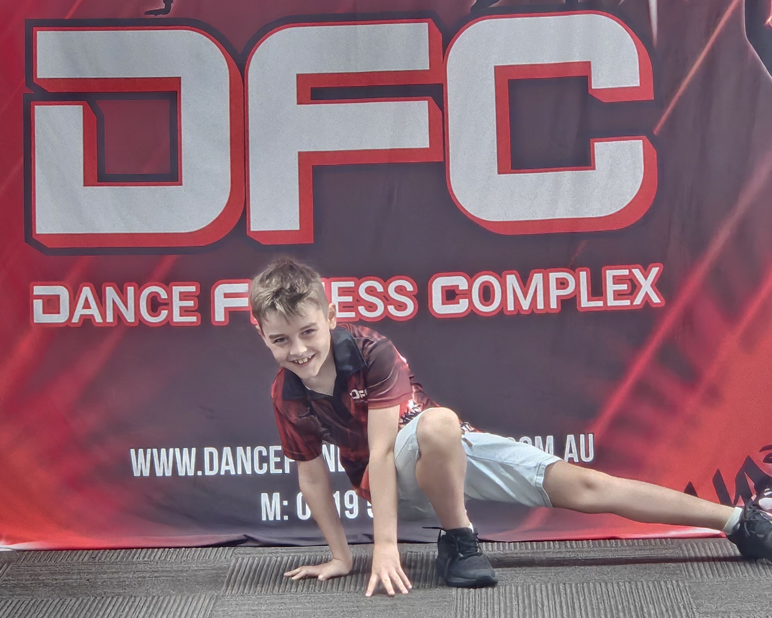 DFC student practising a Breaking freeze during Hip Hop training